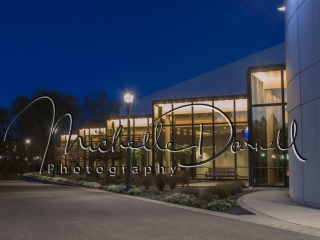 The back side of the INBC Performing Arts building at night in downtown Spokane, Washington, as viewed from the Riverfront Park boardwalk. 72 dpi, 300 dpi, 600 dpi